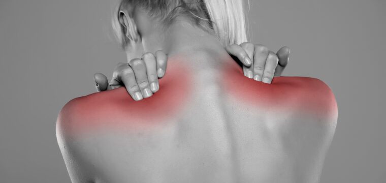 How do large breasts cause back pain