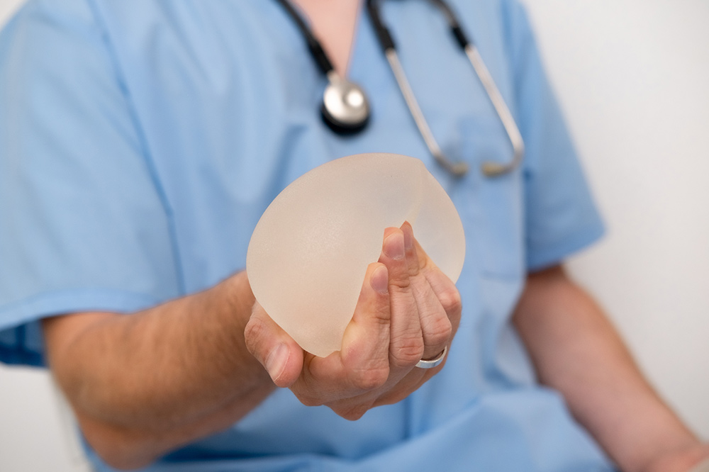 breast implant removal, swelling and bruising, scarring and asymmetry